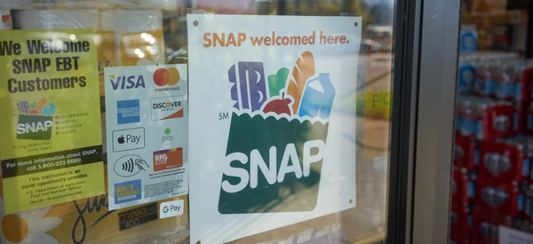 Image of an entrance to a store with a sign reading 