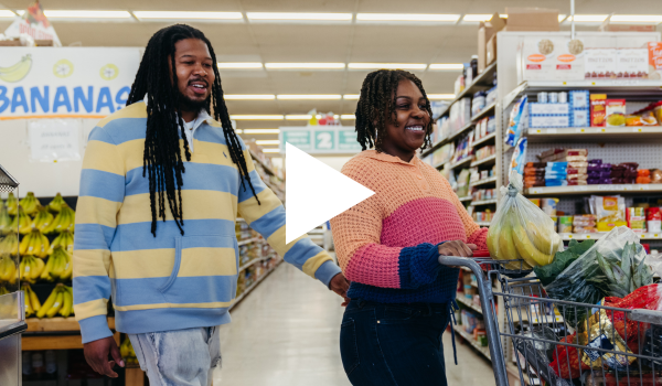 Screenshot from a video about Good Food for All - a family shops for groceries as part of the program